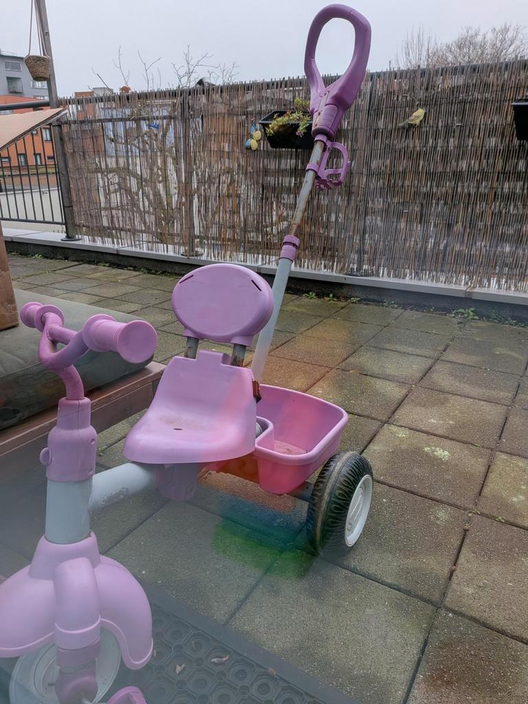 Gratis roze duwfiets met duwstang