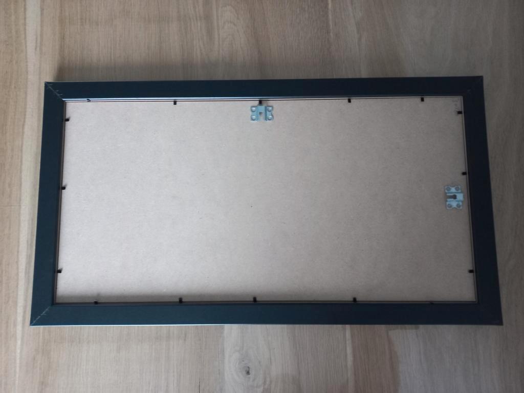 GRATIS: Fotolijst 66x36 cm.