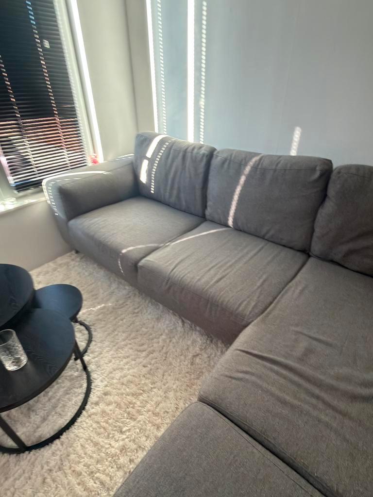 Mooie grijze hoekbank